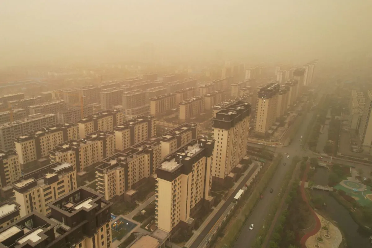 This aerial photo taken on April 11, 2023 shows buildings during a sandstorm in Linyi, in China's eastern Shandong province. (Photo by AFP) / China OUT (Photo by STR/AFP via Getty Images)