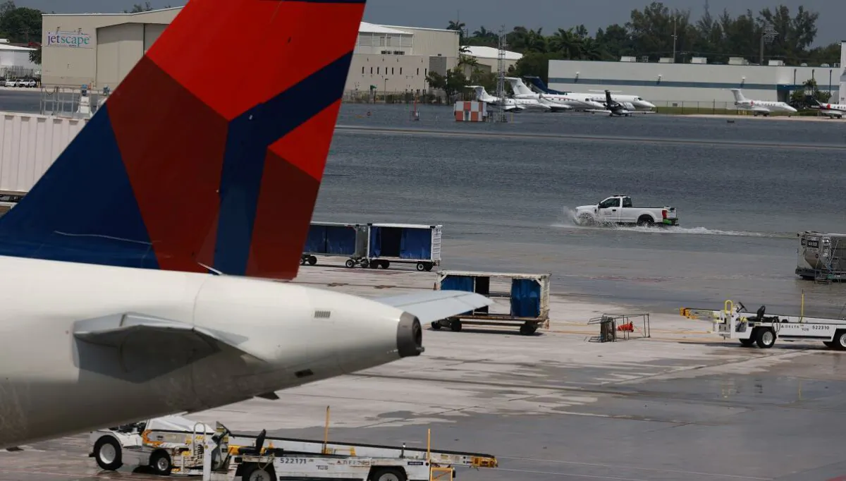 Planes sit at their gates after the Fort Lauderdale-Hollywood International Airport was closed due to the runways being flooded on April 13, 2023 in Fort Lauderdale, Florida. (Joe Raedle/Getty Images)