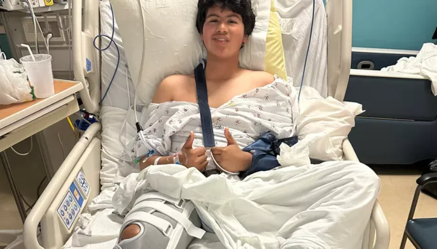 Joshua Mora, 13, is seen in the hospital, where he has undergone several surgeries. (Courtesy of GoFoundMe)