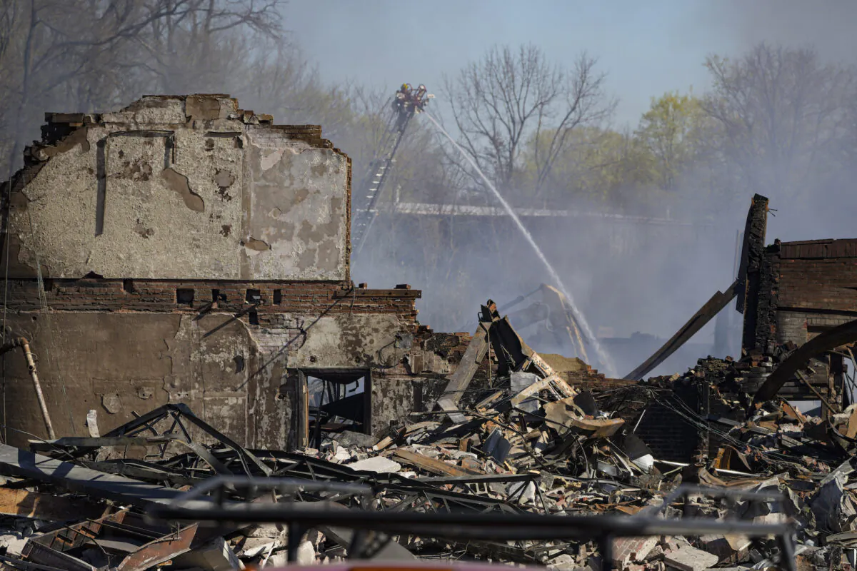 Firefighters pour water on an industrial fire in Richmond, Ind., on April 13, 2023. (Michael Conroy/AP Photo)