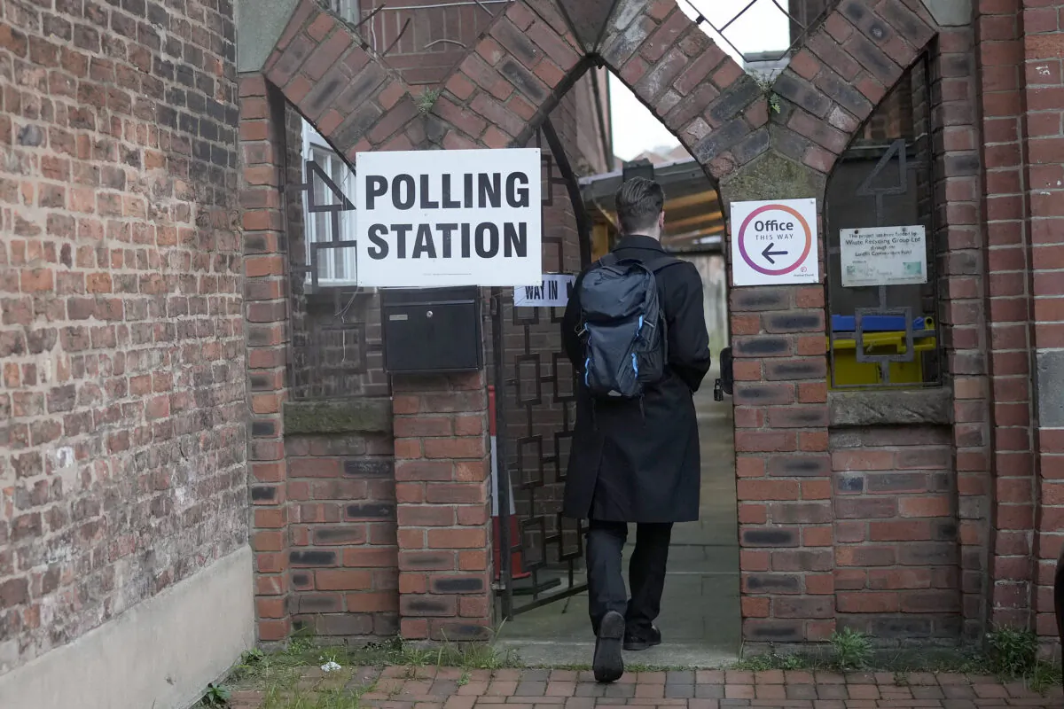 A member of the public goes to vote in the Chester by-election at the Festival Church polling station in Chester, England, on Dec. 1, 2022. (Christopher Furlong/Getty Images)
