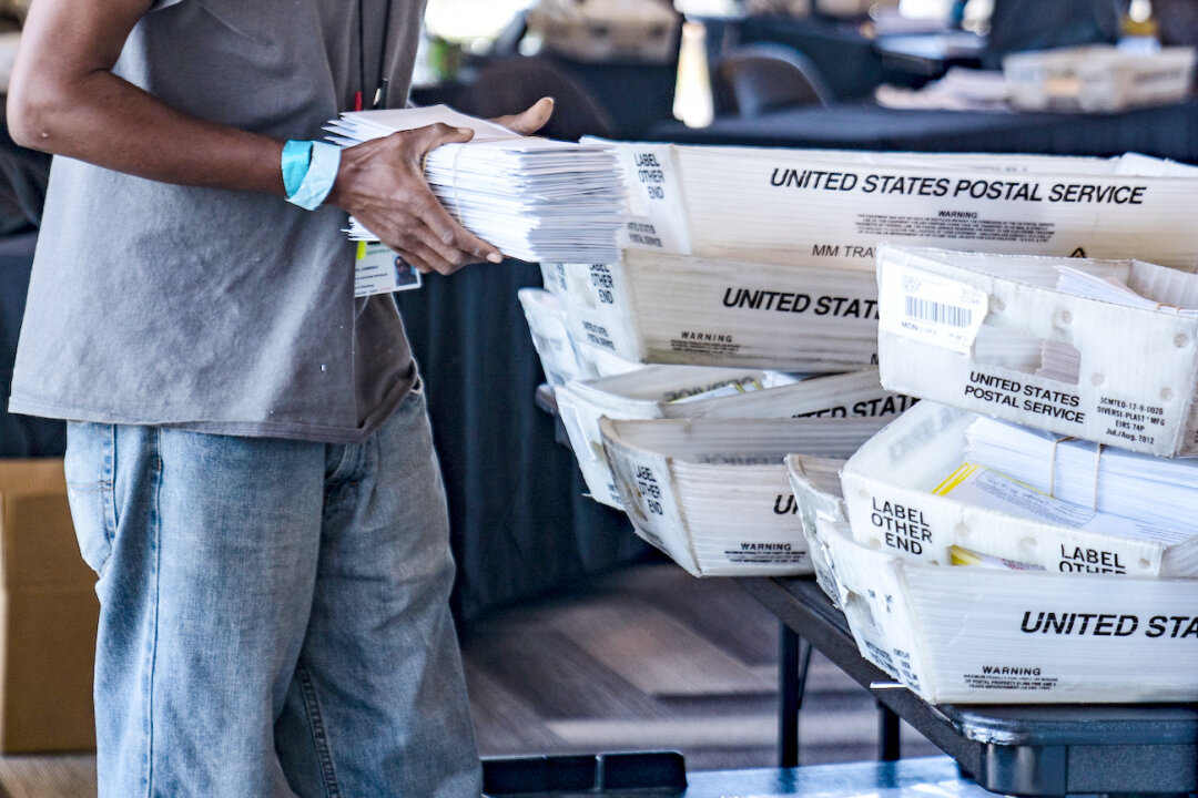 An election worker processes absentee ballots in Atlanta on Nov. 2, 2020. (Megan Varner/Getty Images)
