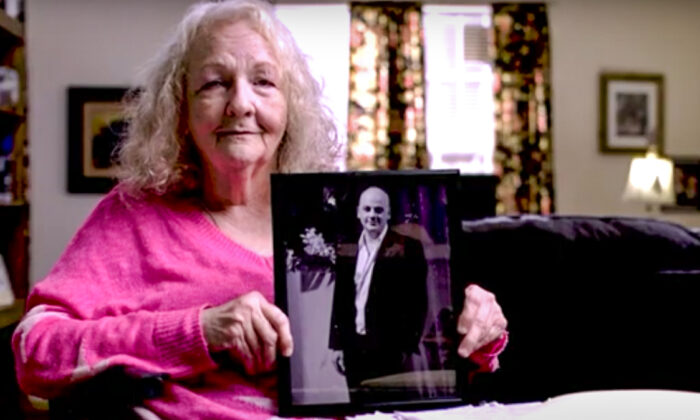 Texas resident Katherine Swidan holds a picture of her son Mark, who has been held in China for a decade. (Courtesy of the Swidan family)