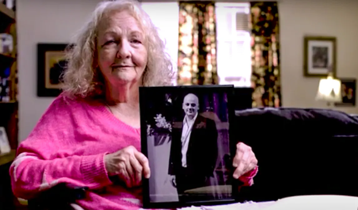 Texas resident Katherine Swidan holds a picture of her son Mark, who has been held in China for a decade. (Courtesy of the Swidan family)
