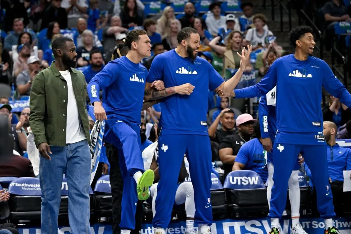 Dallas Mavericks forward Tim Hardaway Jr. (11) and center Dwight Powell (7) and center JaVale McGee (00) and forward Christian Wood (35) celebrate on the team bench during the second quarter against the San Antonio Spurs at the American Airlines Center in Dallas on April 9, 2023. (Jerome Miron/USA TODAY Sports via Field Level Media)