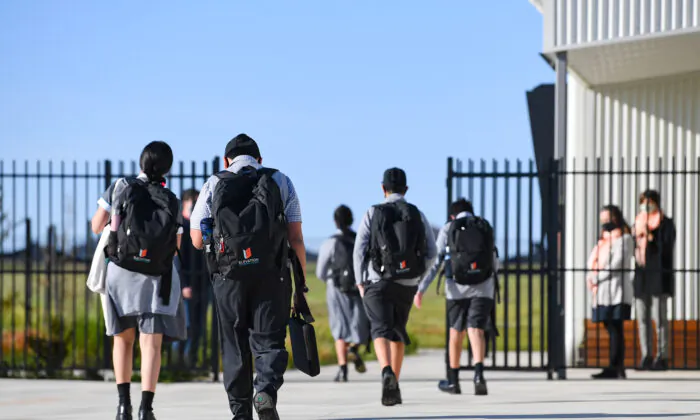 Year seven students arrive to Elevation Secondary College in Craigieburn, Melbourne, Australia, on Oct. 12, 2020. (AAP Image/James Ross)