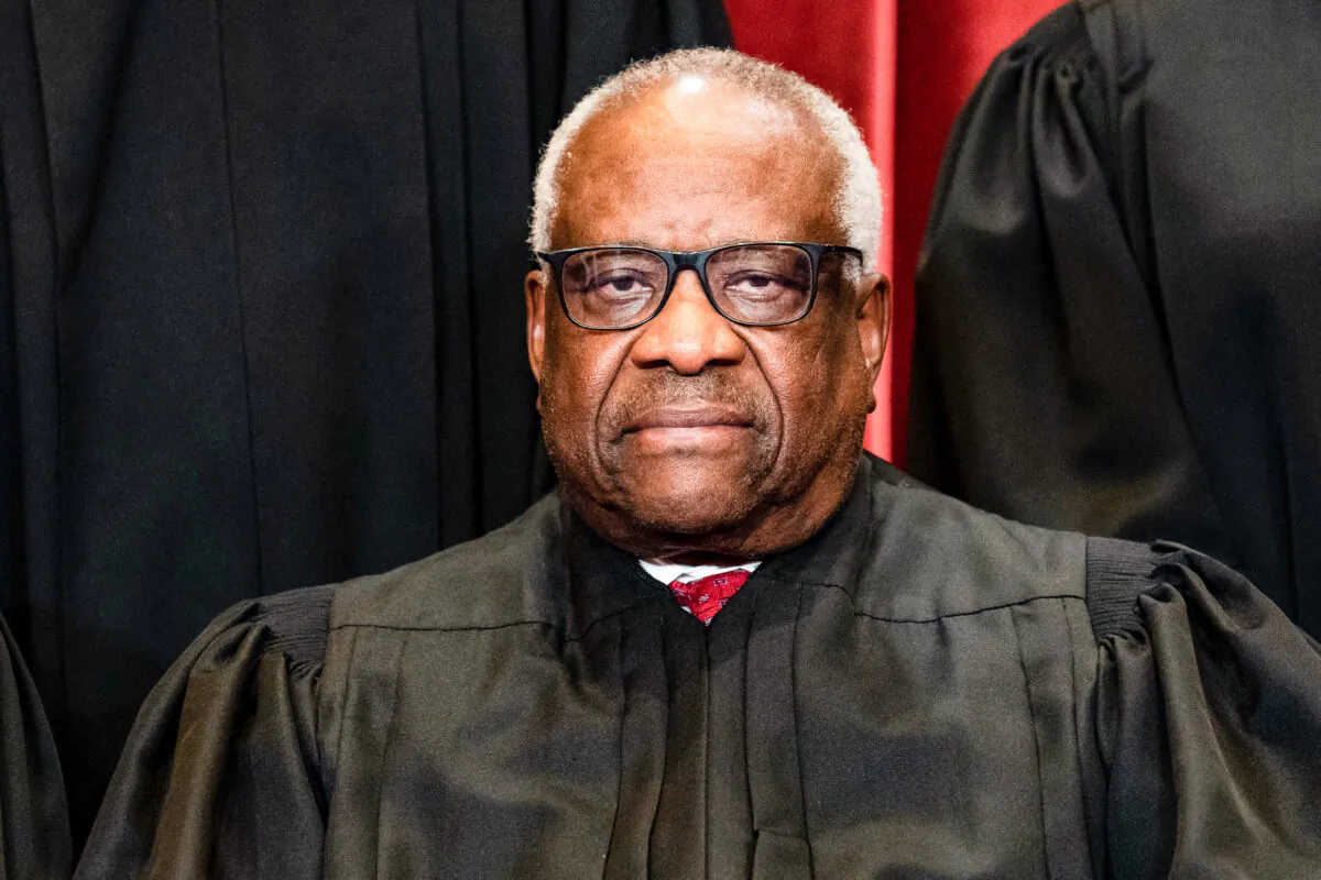 Supreme Court Justice Clarence Thomas sits during a group photograph of the justices at the Supreme Court in Washington on April 23, 2021. (Erin Schaff/Pool/AFP via Getty Images)