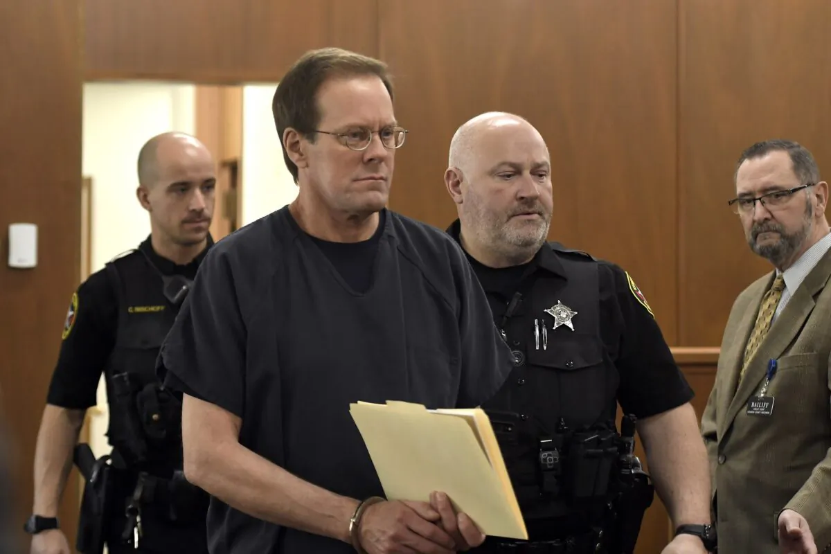Mark Jensen makes his way into the courtroom for his sentencing hearing in Kenosha, Wis., on April 14, 2023. (Sean Krajacic/Pool/The Kenosha News via AP)