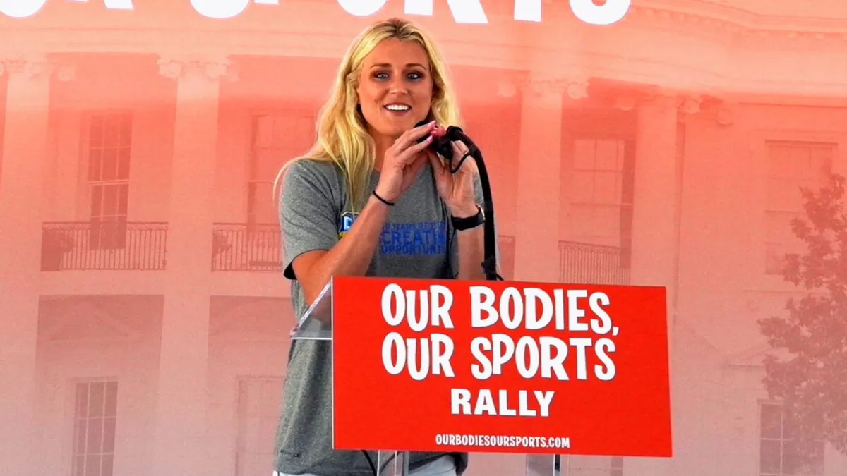 Riley Gaines Barker, a former University of Kentucky swimmer who tied for fifth place with transgender swimmer Lia Thomas at the NCAA Championships in March, speaks at the “Our Bodies, Our Sports” rally at Freedom Plaza in Washington on June 23, 2022. (Terri Wu/The Epoch Times)