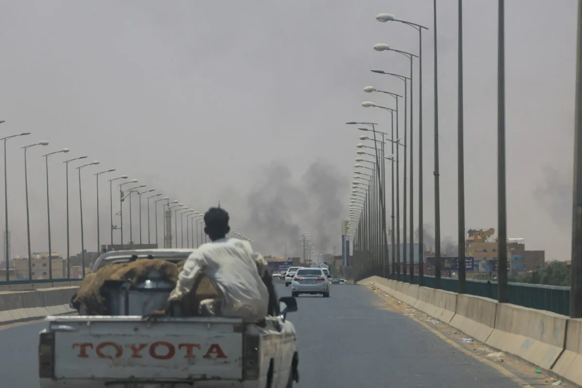 Smoke rises in Omdurman, near Halfaya Bridge, during clashes between the Paramilitary Rapid Support Forces and the army as seen from Khartoum North, Sudan, on April 15, 2023. (Mohamed Nureldin Abdallah/Reuters)