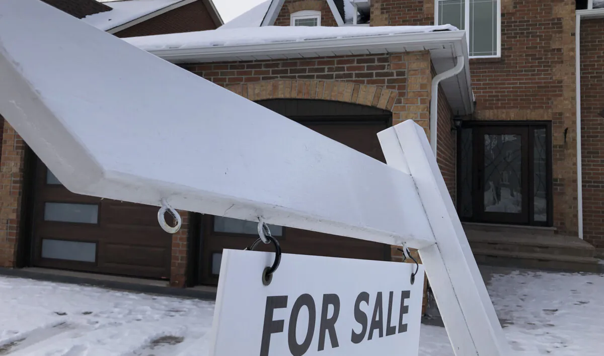 A for sale sign in front of a house in Oakville, Ont., west of Toronto, on Feb. 5, 2023. (Richard Buchan/The Canadian Press)