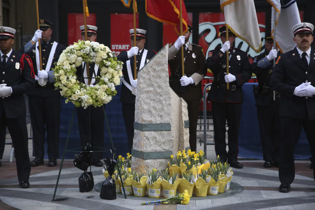 Emergency responders gather at a memorial for victims of the 2013 Boston Marathon bombing, in Boston on April 15, 2023. (Reba Saldanha/AP Photo)