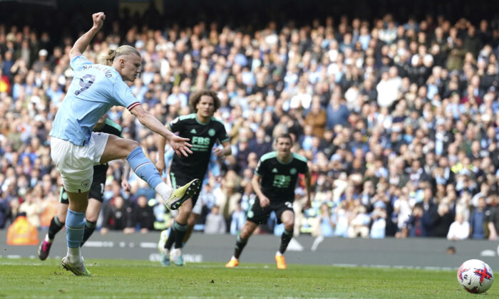 Manchester City's Erling Haaland scores his side's second goal during the English Premier League soccer match between Manchester City and Leicester City at Etihad Stadium in Manchester, England, on April 15, 2023. (Nick Potts/PA via AP)