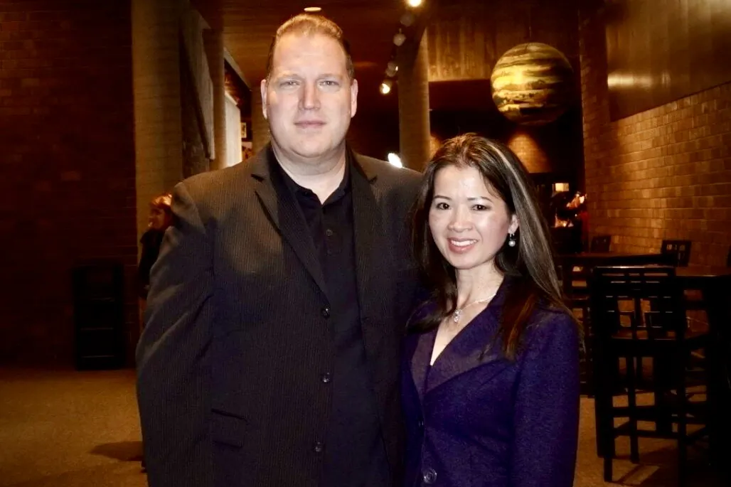 Shad Olson (L) enjoyed Shen Yun's evening performance at The Monument, in Rapid City, on April 15, 2023. (Nancy Ma/The Epoch Times)