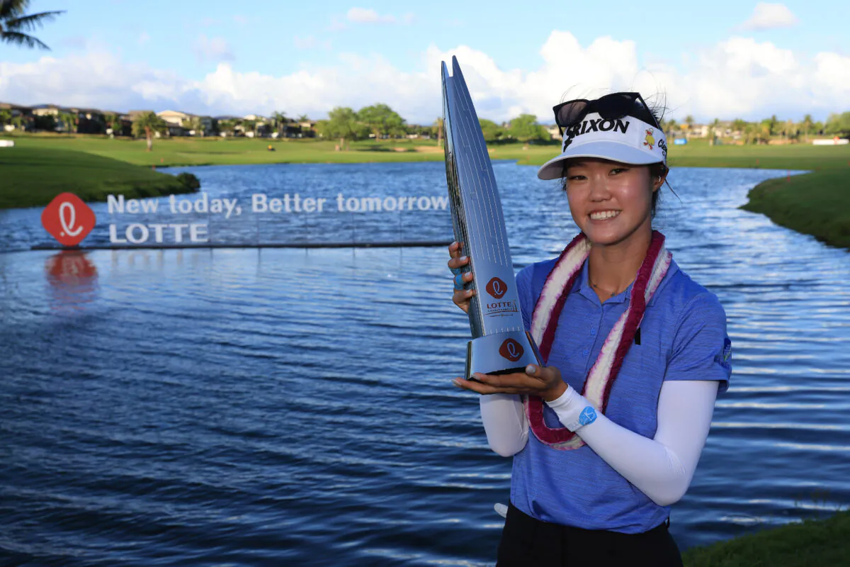Grace Kim of Australia poses with the Lotte Championship trophy after winning the LOTTE Championship presented by Hoakalei at Hoakalei Country Club in Ewa Beach, Hawaii, on April 15, 2023. (Sean M. Haffey/Getty Images)