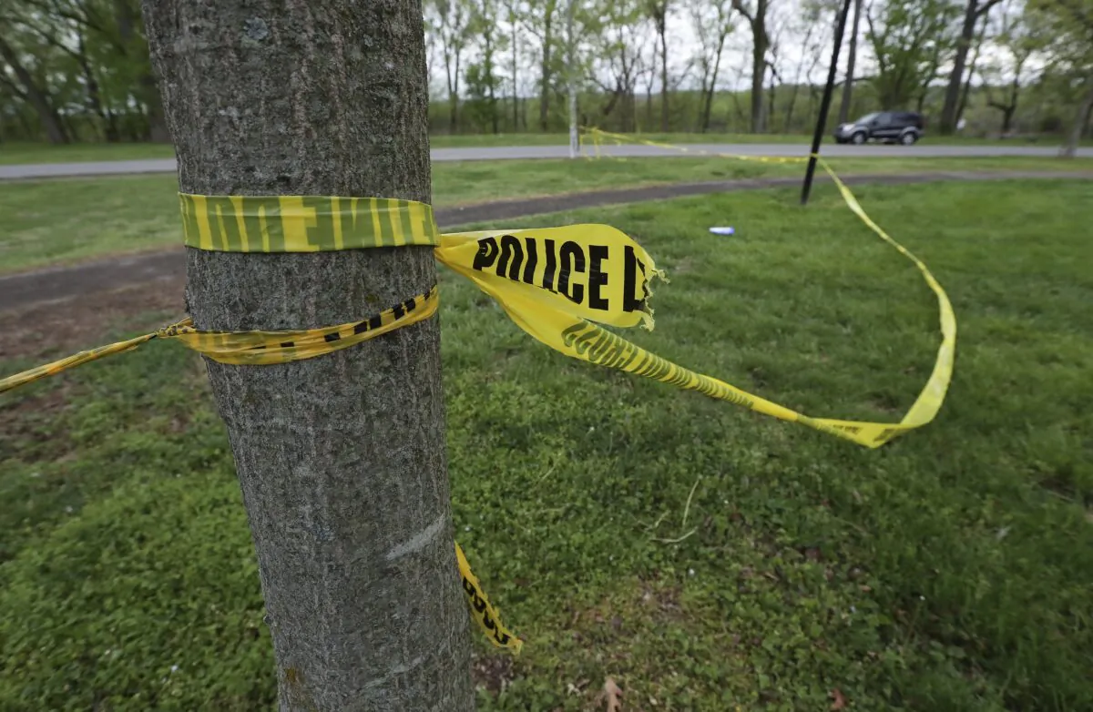Police tape are seen in a park in a file photo. (Sam Upshaw/Courier Journal via AP)