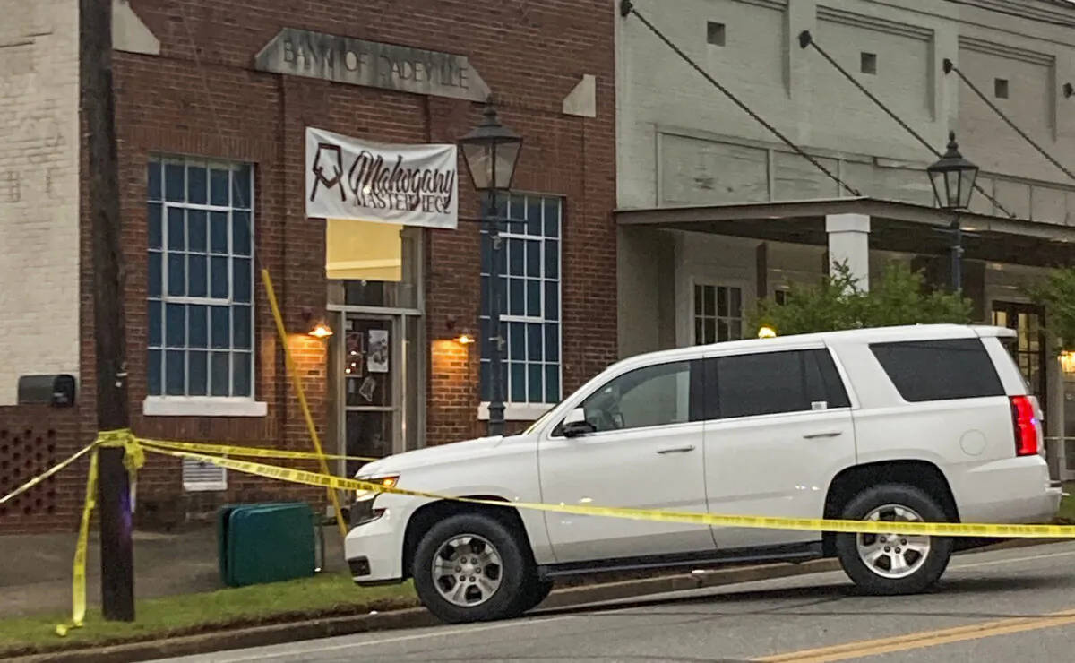 Investigators work at the site of a fatal shooting in downtown Dadeville, Ala., on April 16, 2023. (Alex Gladden/The Montgomery Advertiser via AP)
