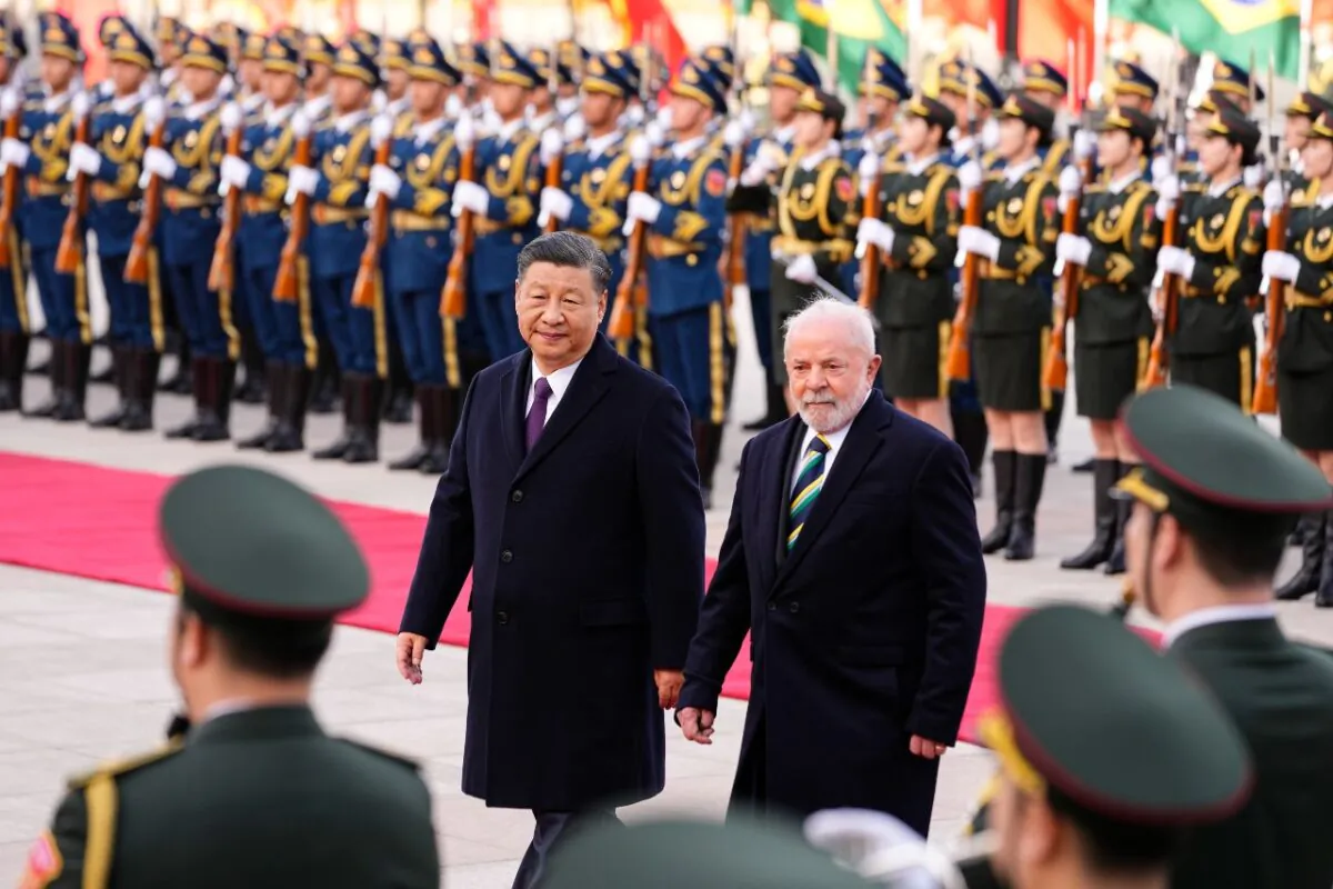Brazilian President Luiz Inácio Lula da Silva (R) inspects an honor guard with Chinese leader Xi Jinping during a welcome ceremony held outside the Great Hall of the People in Beijing on April 14, 2023. (Ken Ishii,-Pool/Getty Images)