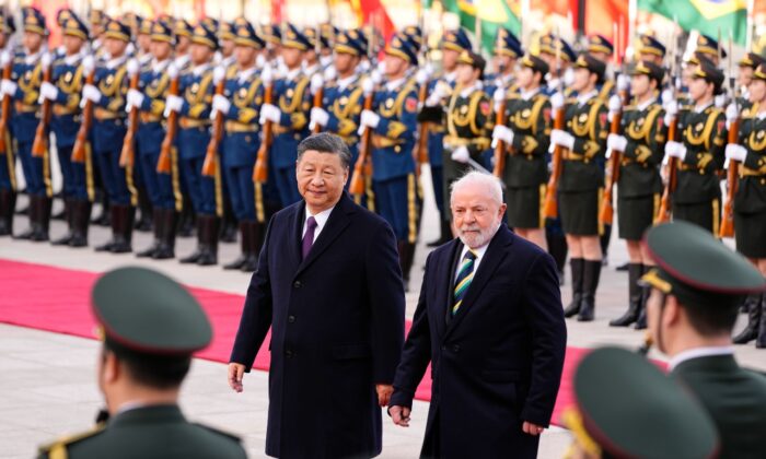 Brazilian President Luiz Inacio Lula da Silva (R) inspects an honor guard with Chinese leader Xi Jinping during a welcome ceremony held outside the Great Hall of the People in Beijing, China, on April 14, 2023. (Ken Ishii,-Pool/Getty Images)