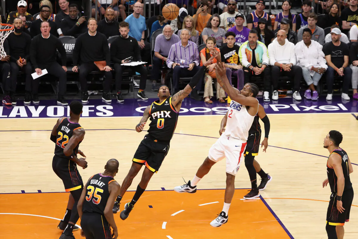 Kawhi Leonard (2) of the LA Clippers puts up a shot over Torrey Craig (0) of the Phoenix Suns during the first half Game One of the Western Conference First Round Playoffs at Footprint Center in Phoenix on April 16, 2023. (Christian Petersen/Getty Images)