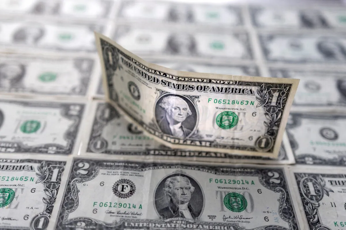 U.S. dollar banknotes, on Feb. 14, 2022. (Dado Ruvic/Reuters)