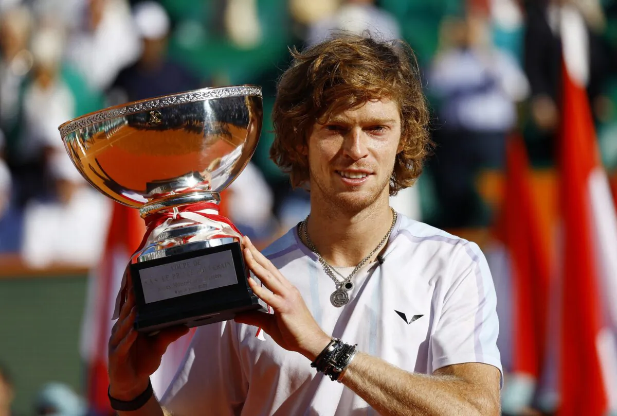 Russia's Andrey Rublev celebrates with the trophy after winning the final against Denmark's Holger Rune during the ATP Masters 1000—Monte Carlo Masters Tennis match at Monte-Carlo Country Club in Roquebrune-Cap-Martin, France, on April 16, 2023. (Eric Gaillard/Reuters)