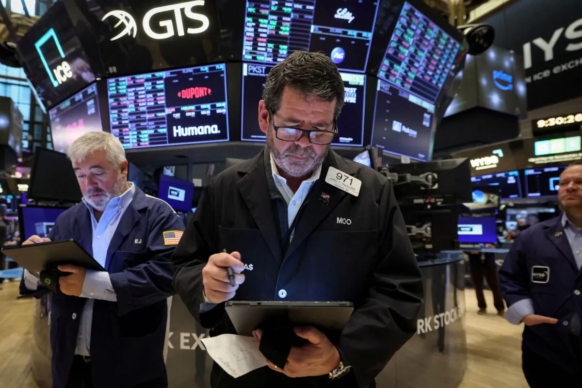 Traders work on the floor of the New York Stock Exchange (NYSE) in New York City, on April 14, 2023. (Brendan McDermid/Reuters)