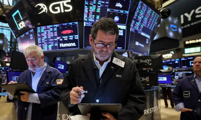Traders work on the floor of the New York Stock Exchange (NYSE) in New York City, on April 14, 2023. (Brendan McDermid/Reuters)
