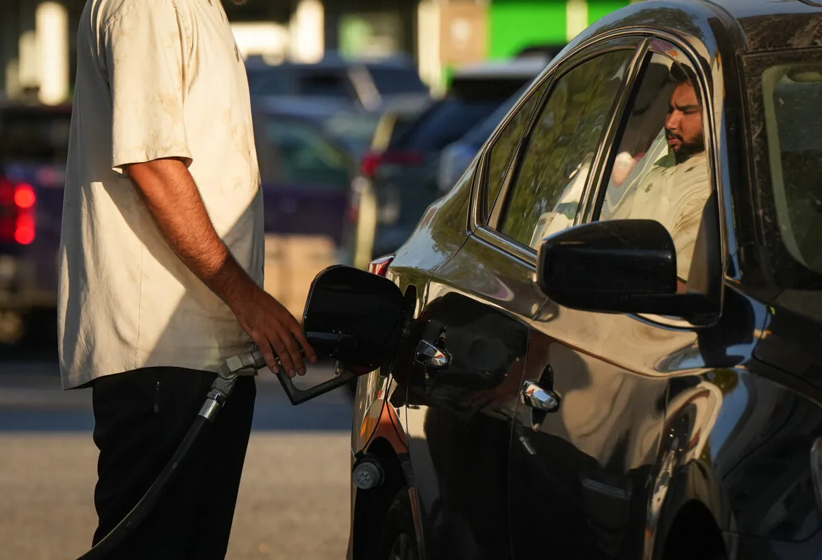 A motorist fuels up at a gas station in Vancouver on Oct. 1, 2022. (The Canadian Press/Darryl Dyck)