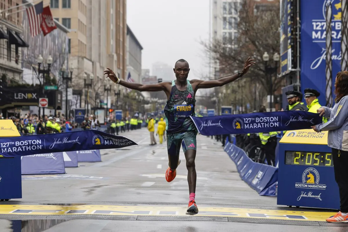 Evans Chebet of Kenya breaks the tape to win the 127th Boston Marathon in Boston on April 17, 2023. (Winslow Townson/AP Photo)
