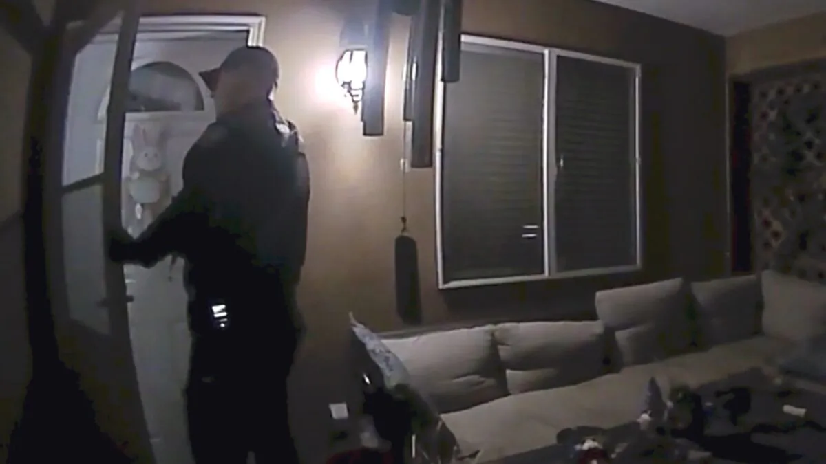 An officer with the Farmington Police Department knocks on a door while responding to the wrong house in Farmington, New Mexico, on April 5, 2023. (Courtesy of Farmington Police Department)