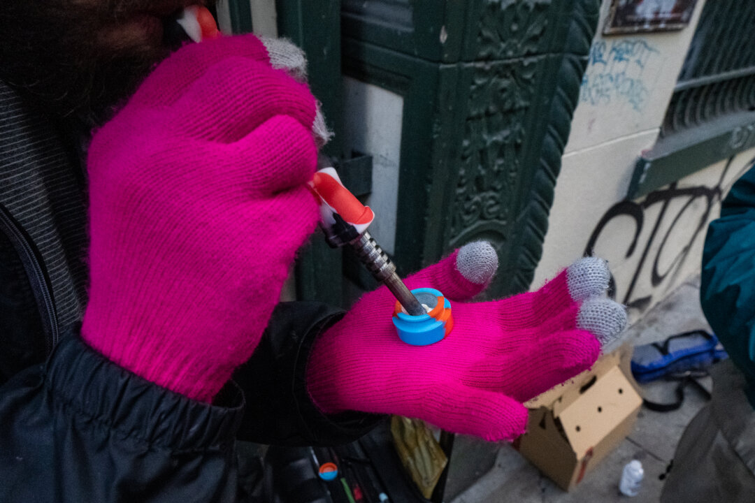 A drug user displays a fentanyl hit before usage in San Francisco, Calif., on Feb. 23, 2023. (John Fredricks/The Epoch Times)