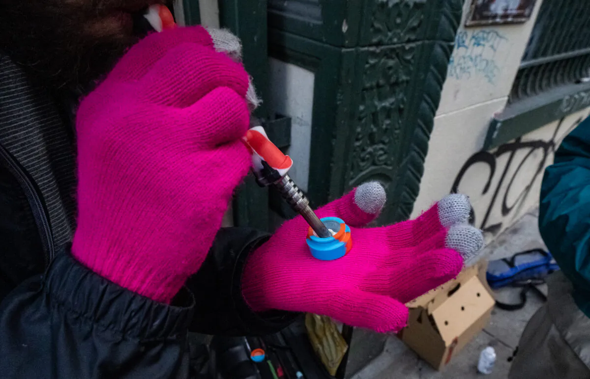 A drug user displays a fentanyl hit before usage in San Francisco, Calif., on Feb. 23, 2023. (John Fredricks/The Epoch Times)
