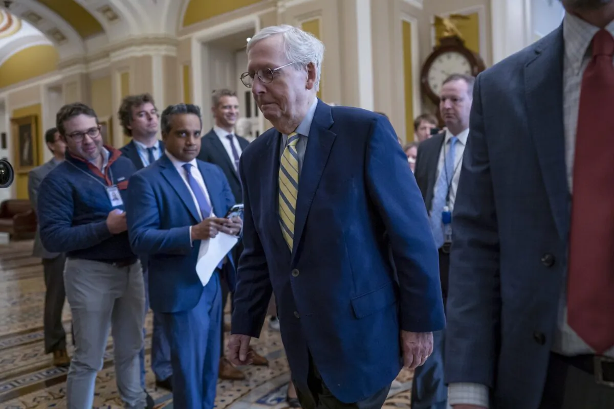 Senate Minority Leader Mitch McConnell (R-Ky.) returns to the chamber almost six weeks after a fall that left him with a rib fracture and concussion, at the Capitol in Washington on April 17, 2023. (J. Scott Applewhite/AP Photo)