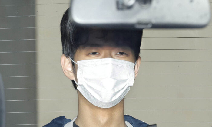 24 year-old Ryuji Kimura, suspected of a smoke bomb attack on Japan's Prime Minister Fumio Kishida, is seen inside a police van as he is taken to prosecutors,' at Wakayama-nishi police station in Wakayama, Japan, on April 17, 2023. (Kyodo via REUTERS/File Photo)