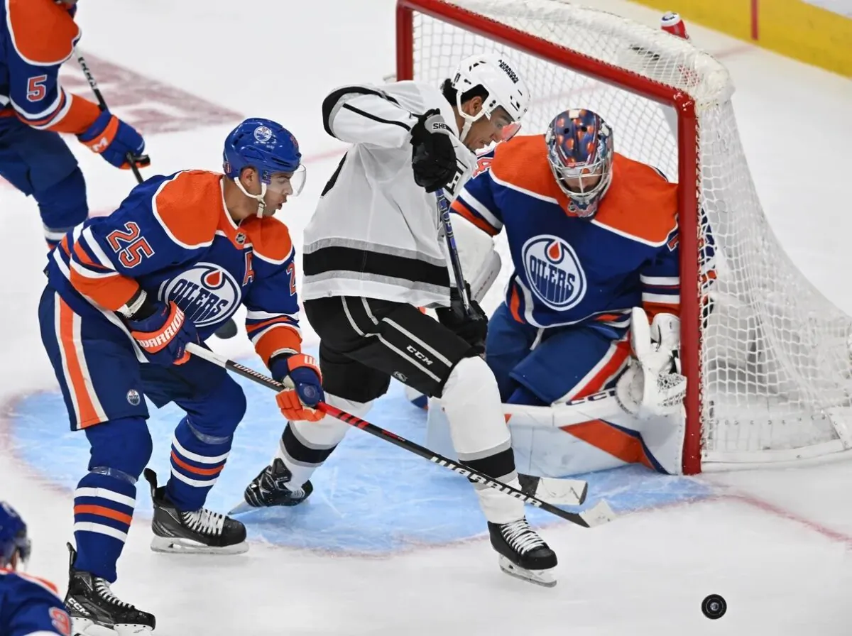 Edmonton Oilers defenseman Darnell Nurse battles with Los Angeles Kings centre Quinton Byfield (55) as Oilers goalie Stuart Skinner (74) defends during the second period in game one of the first round of the 2023 Stanley Cup Playoffs at Rogers Place, in Edmonton, Alberta, Canada, on April 17, 2023. (Walter Tychnowicz-USA TODAY Sports via Field Level Media)