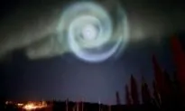 Odd Spiral Appears Amid Northern Lights in Alaska Night Sky