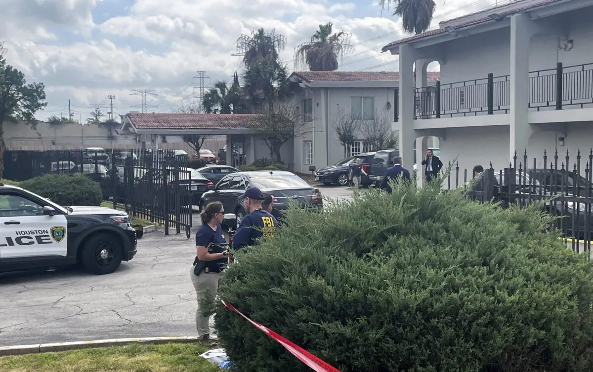 The FBI works on the scene of a shooting in north Houston on March 23, 2023. (Ralph Green/Houston Chronicle via AP)