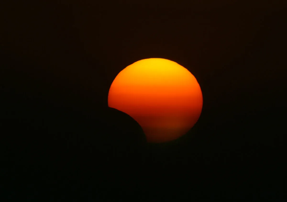 This picture taken on Nov. 3, 2013 shows a rare hybrid solar eclipse, in the northern Iraqi city of Arbil. (Photo credit SAFIN HAMED/AFP via Getty Images)