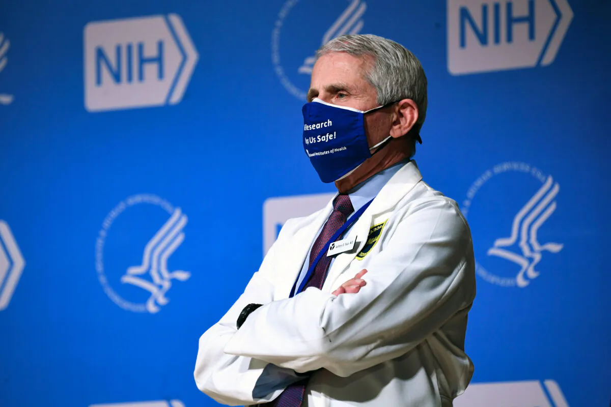 Former Director of the National Institute of Allergy and Infectious Diseases (NIAID) Dr. Anthony Fauci listens to President Joe Biden (out of frame) speak during a visit to the National Institutes of Health (NIH) in Bethesda, Md., on Feb. 11, 2021. (Saul Loeb/AFP via Getty Images)