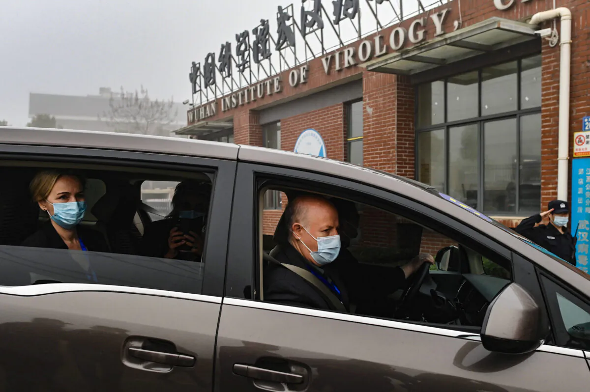 Peter Daszak of the EcoHealth Alliance (R) and other members of the World Health Organization (WHO) team investigating the origins of the COVID-19 coronavirus, arrive at the Wuhan Institute of Virology on Feb. 3, 2021. (Hector Retamal/AFP via Getty Images)