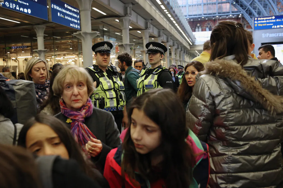 Police Officers assist members of the public at the entrance to the Eurostar at St Pancras Station in London, on March 22, 2016. (Dan Kitwood/Getty Images)