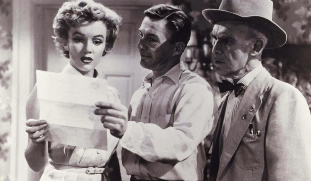 A publicity still for "We're Not Married!" from 1952 with (L-R) Marilyn Monroe, David Wayne, and James Gleason. (MovieStillsDB)