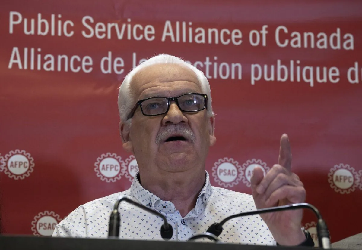 Public Service Alliance of Canada National President Chris Aylward speaks during a news conference at union headquarters, April 17, 2023 in Ottawa. (The Canadian Press/Adrian Wyld)
