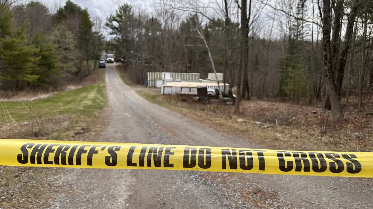 A sheriff's department caution tape is set up at the entrance of a crime scene in Bowdoin, Maine, on April 19, 2023. (Rodrique Ngowi/AP Photo)