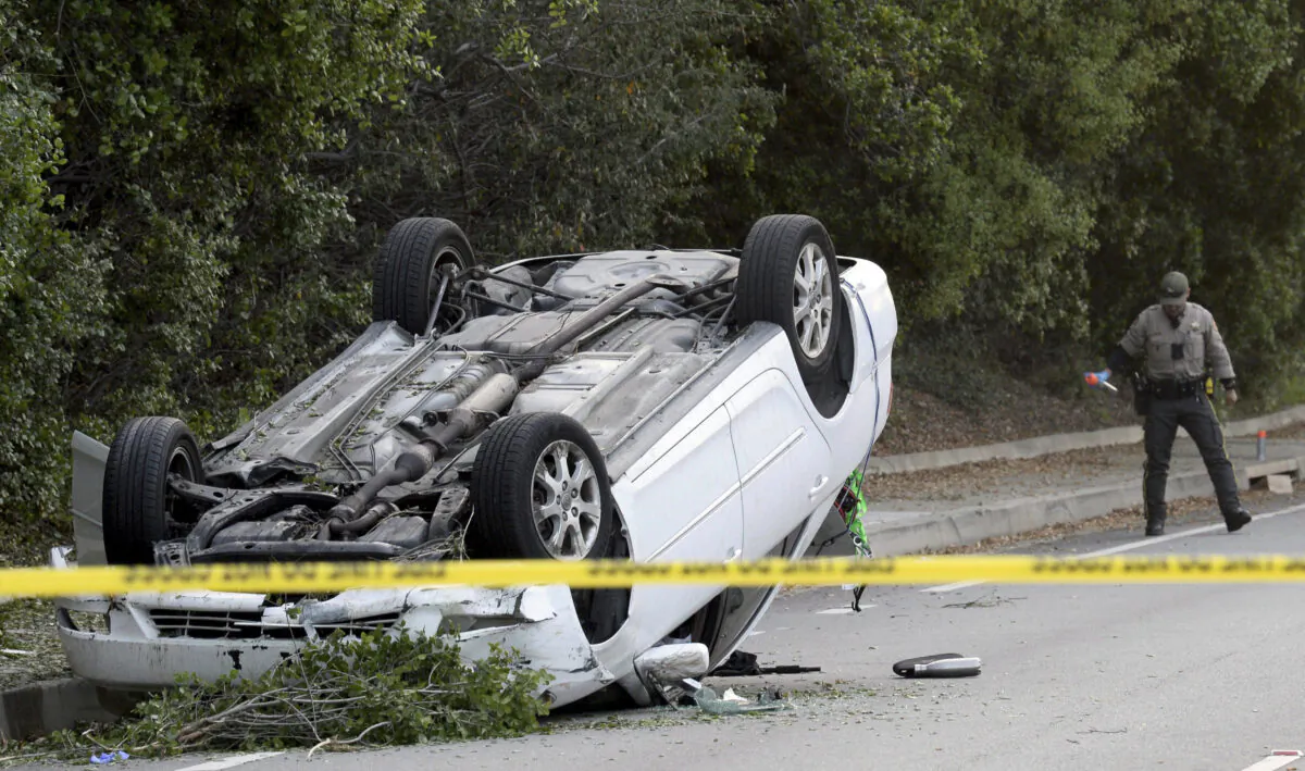 Law enforcement personnel investigate the scene of a crash in a file photo in Thousand Oaks, Calif., on April 18, 2023. (Juan Carlo/Ventura County Star via AP)