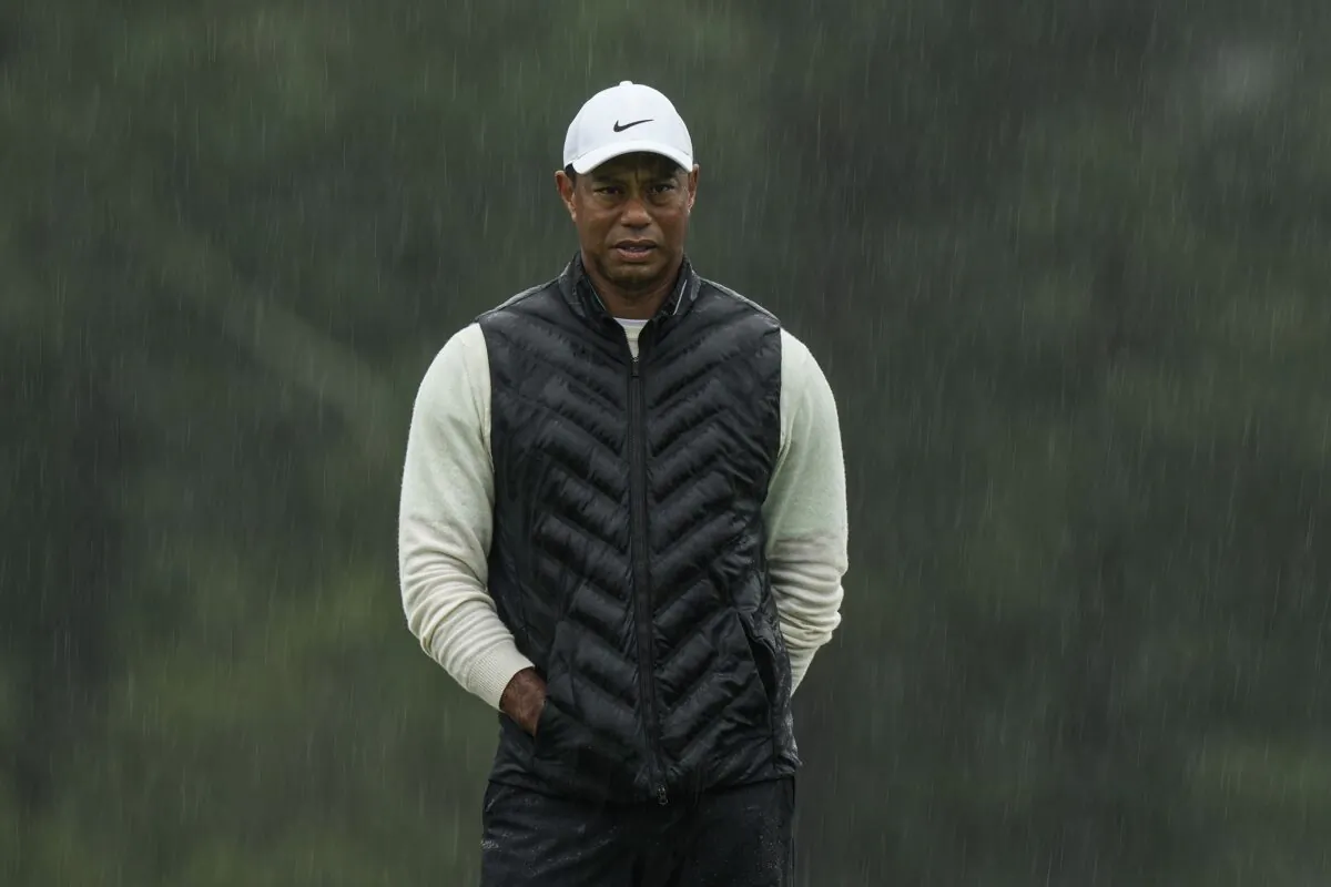 Tiger Woods walks on the 18th hole during the weather delayed second round of the Masters golf tournament at Augusta National Golf Club in Augusta, Ga., on April 8, 2023. (Charlie Riedel/AP Photo)