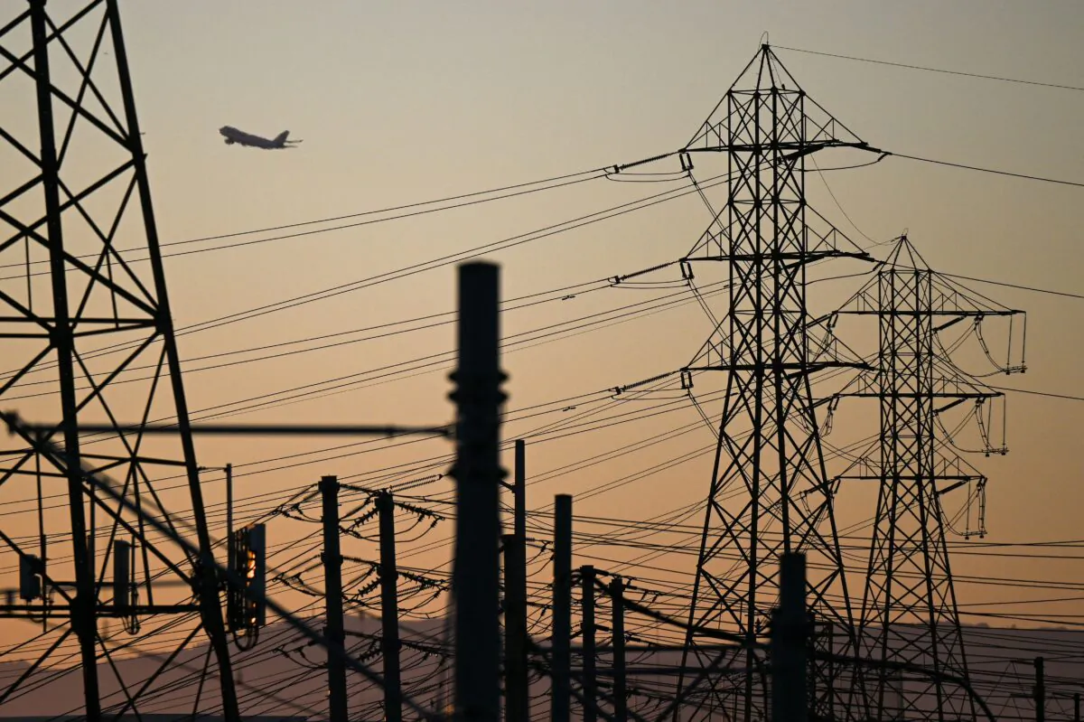 Electric power lines at sunset in El Segundo, California. (Patrick T. Fallon/AFP via Getty Images)