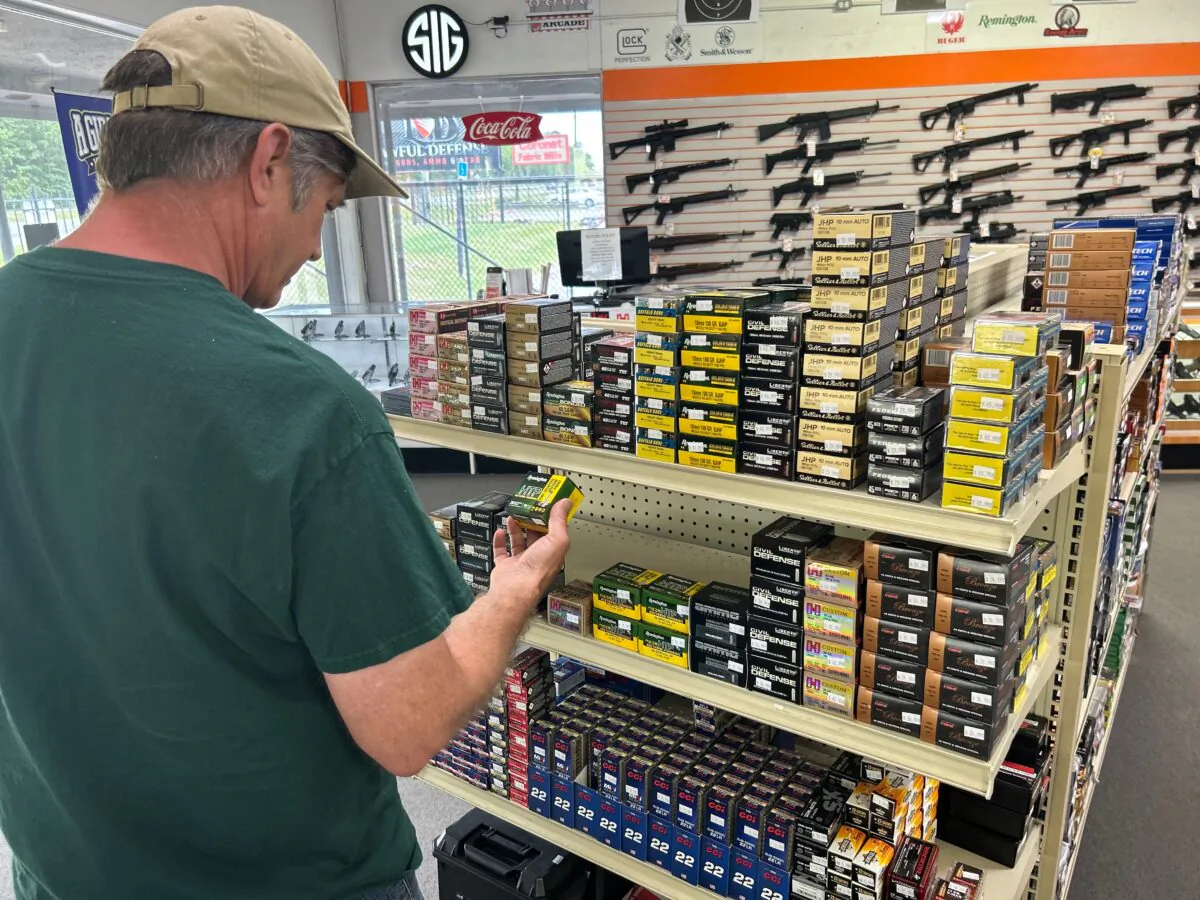 A customer shops for ammunition at Lawful Defense in Gainesville, Fla., on April 19, 2023. (Nanette Holt/The Epoch Times)