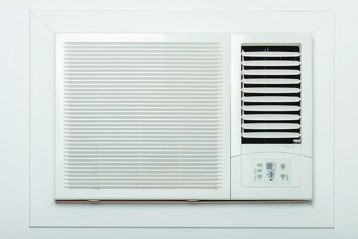An old styled air conditioner on the wall. (Shutterstock)